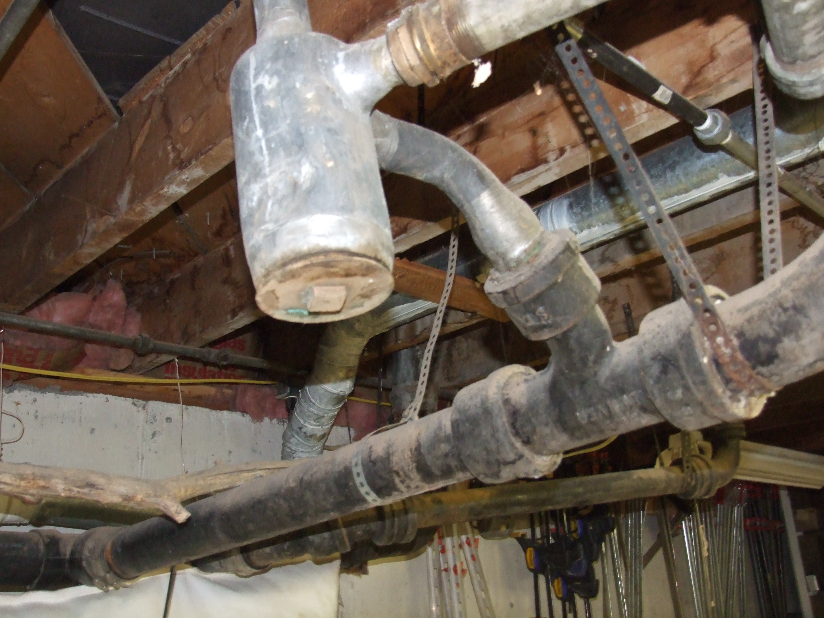 I think they call this "plumbing".  Note the galvanized and black pipe for the water supply;-0